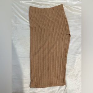 One slit tan skirt.
